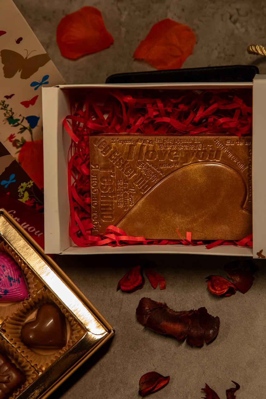 Premium Chocolate gifts inside a decorative box with red ribbons, perfect for Valentine's celebrations.