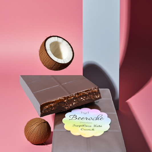 Keto Chocolate TropiCoco Keto Crunch bar with coconut, showcasing layers and vibrant pink background.