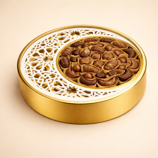 Ramadan Gifts - Golden crescent tray filled with chocolate-dipped stuffed dates and assorted chocolates.