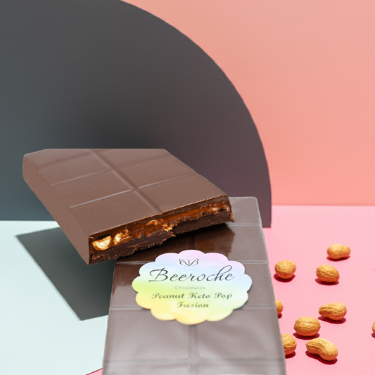 Keto Chocolate Peanut Pop Fusion bar with creamy praline and roasted peanuts on colorful background.